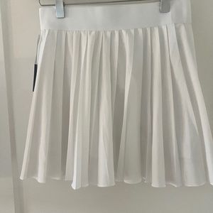 TNA Tennis Skirt Size Small.  Never worn with tags.